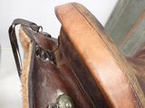 a close up view of a saddle with a leather seat