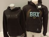 two mannequins with hoodies on display in a clothing store