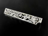 an antique diamond bar broochle