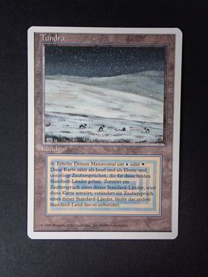 a close up of a card with a picture of a snow covered mountain