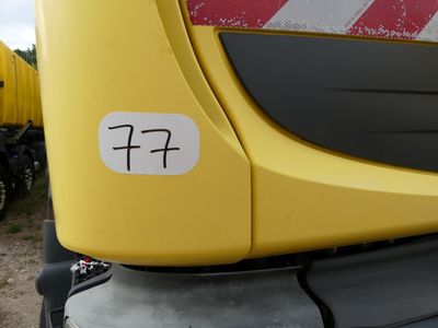 a close up of a yellow truck with a number on it