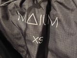 the back of a black jacket with a white logo on it