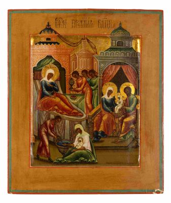une icône représentant la naissance de Jésus, dans un cadre en bois