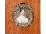 portrait of a woman in a blue dress on a wooden plaque