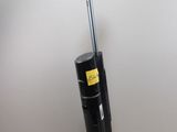 a close up of a vacuum cleaner on a bed in a room