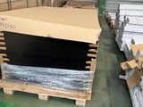 many boxes and pallets in a warehouse with boxes on the floor