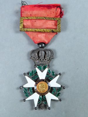 an image of a medal with a star on it on a gray surface