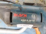a close up of a drill with a tag on it