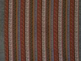 a close up of a red and blue striped rug with fringes