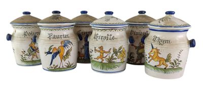 four canisters with animals painted on them sitting next to each other
