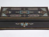 a black box with a blue and gold design on it