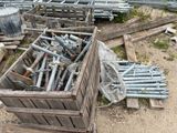 a pile of metal pipes and pipes in a wooden crate