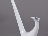 an image of a white vase with a curved handle