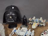 many star wars action figures on a wooden table
