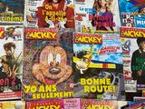 a lot of magazines on the table with pictures on them