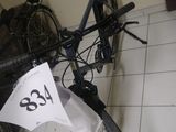 a bicycle that is sitting on the floor with a price tag attached to it