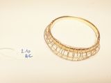 a gold ring with a diamond on it and a price tag