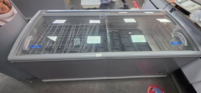 a glass display case in the middle of a store