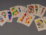 many cards with different designs on them sitting on a table