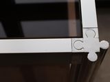 a close up of a glass table with a white flower on it