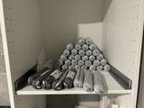 many rolls of toilet paper on a shelf in the bathroom
