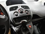 a dashboard of a small car with a clock on the dash