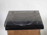 a black microwave sitting on top of a cardboard box