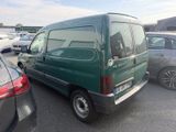 a picture of a green van parked in a parking lot