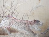 a picture of a painting of a tiger running in the grass