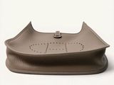 brown leather purse on a white background with a logo on the front