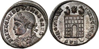 a silver coin with an image of a man in a cage on it