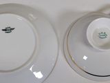 two plates and a bowl on the table