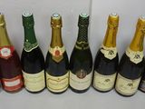 several bottles of wine are lined up on a table