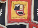 a scarf with a picture of a coat of arms on it