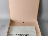 the box is open to show the contents of a chanet watch