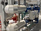 pipes and valves in a large room with a lot of pipes