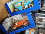 many toy cars that are in a box together