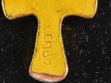 an image of a yellow cross on a black surface