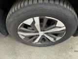a close up of a tire on the side of a car