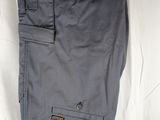 men ' s grey cargo pants with a tag on the side of the pants