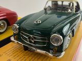 two toy cars that are sitting on top of a box