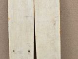 two surfboards sitting on a tiled floor next to each other