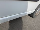 a white car parked on the side of the road