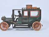 a small toy car with a man in the driver ' s seat