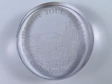 a glass plate with a picture of a town on it