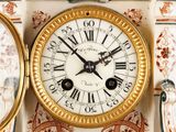 a clock with roman numerals on the face of it