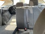 the back seats of a car with a seat belt in the back of it