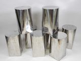 several pieces of silver metal are stacked on top of each other