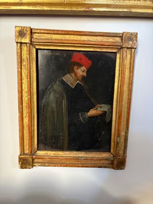 a painting of a man with a red hat on a wall
