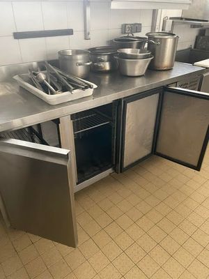 many pots and pans on the counter in the kitchen